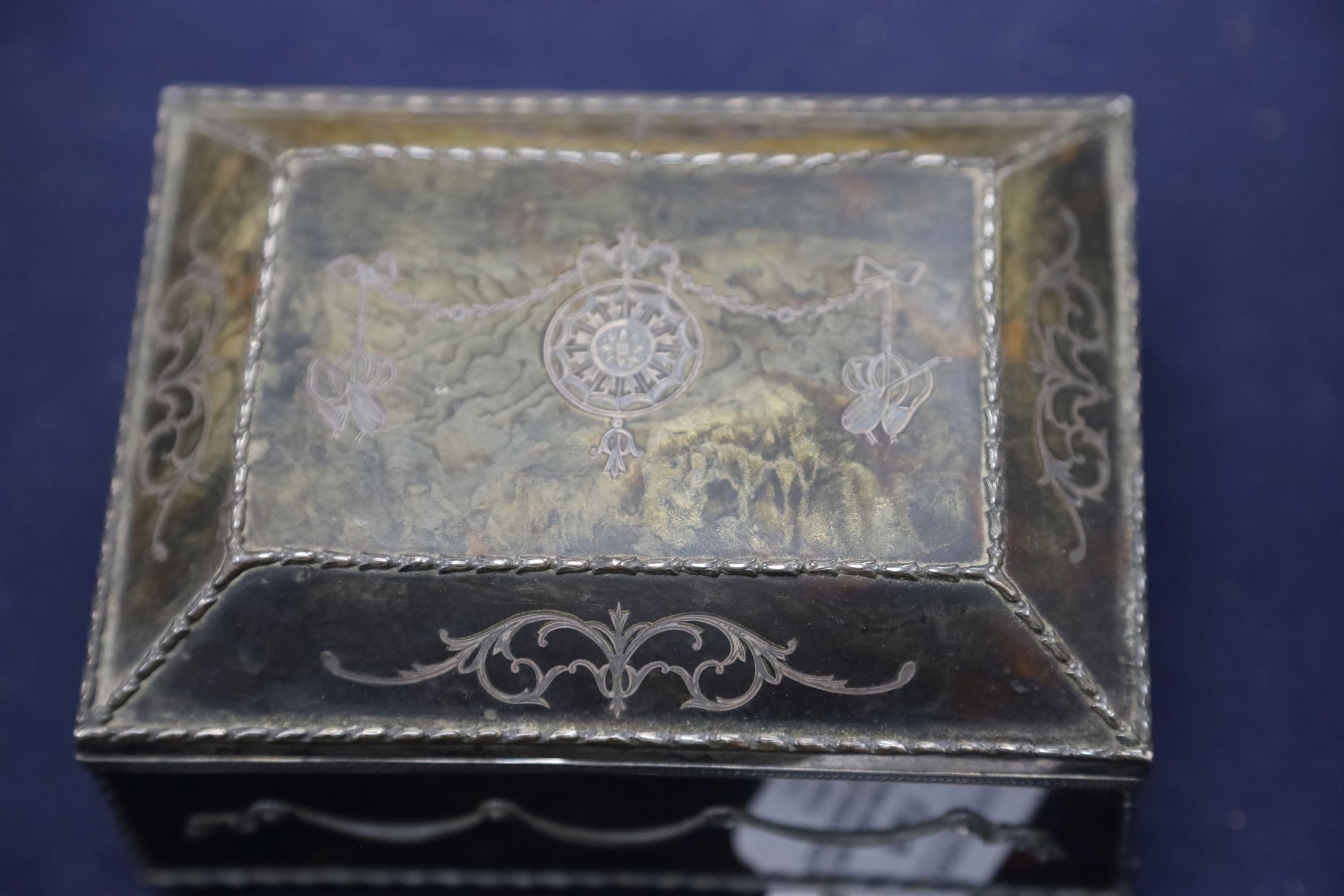 A silver-mounted tortoiseshell pique rectangular trinket box, by William Comyns, raised on four ball feet, London, 1904, width 15cm. 15cm